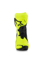 Bottes Alpinestars Supertech R, bottes de course moto, jaune fluo et noir, vue de face montrant le logo étoile noir sur la plaque tibiale, zones de flexion à texture en nid d'abeille et design profilé pour la course haute performance.