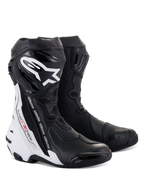 Bottes Alpinestars Supertech R Vented, bottes de course moto, noir et blanc, dotées de nombreuses perforations pour la ventilation, logo blanc imposant sur le tibia, protections en TPU et design aérodynamique pour les performances sur piste.