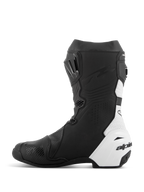 Bottes Alpinestars Supertech R Vented, bottes de moto de course, noir et blanc, vue du côté médial, perforations étendues pour la circulation de l'air, panneaux en microfibre synthétique blanche, renforts en TPU et profil aérodynamique élégant pour la course sur piste.