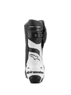 Bottes Alpinestars Supertech R Ventilées, bottes de course moto, noir et blanc, vue arrière montrant des panneaux en microfibre perforée blanche, une protection de talon en TPU noir avec le logo Alpinestars et un système de fermeture réglable