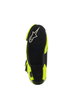 Bottes Alpinestars Supertech R Vented, vue de dessous montrant la semelle en caoutchouc noir, motif d'adhérence texturé pour repose-pieds, logo A-star blanc, botte de moto de course jaune fluo et noir