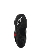 Alpinestars SMX-6 V3 Drystar® laarzen, onderaanzicht van de zool, zwart getextureerd rubber voor grip, voorzien van een wit sterlogo en Alpinestars-branding in reliëf, prestatiegerichte motorlaarzen.
