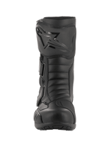 A pair of black Radon Drystar® Boots from Alpinestars EU with a sleek design, featuring reinforced ankles, shin plates, and adjustable straps. The boots boast a combination of smooth and textured leather panels along with a logo emblem on the outer side, providing both style and durable touring protection with 100% waterproofing.