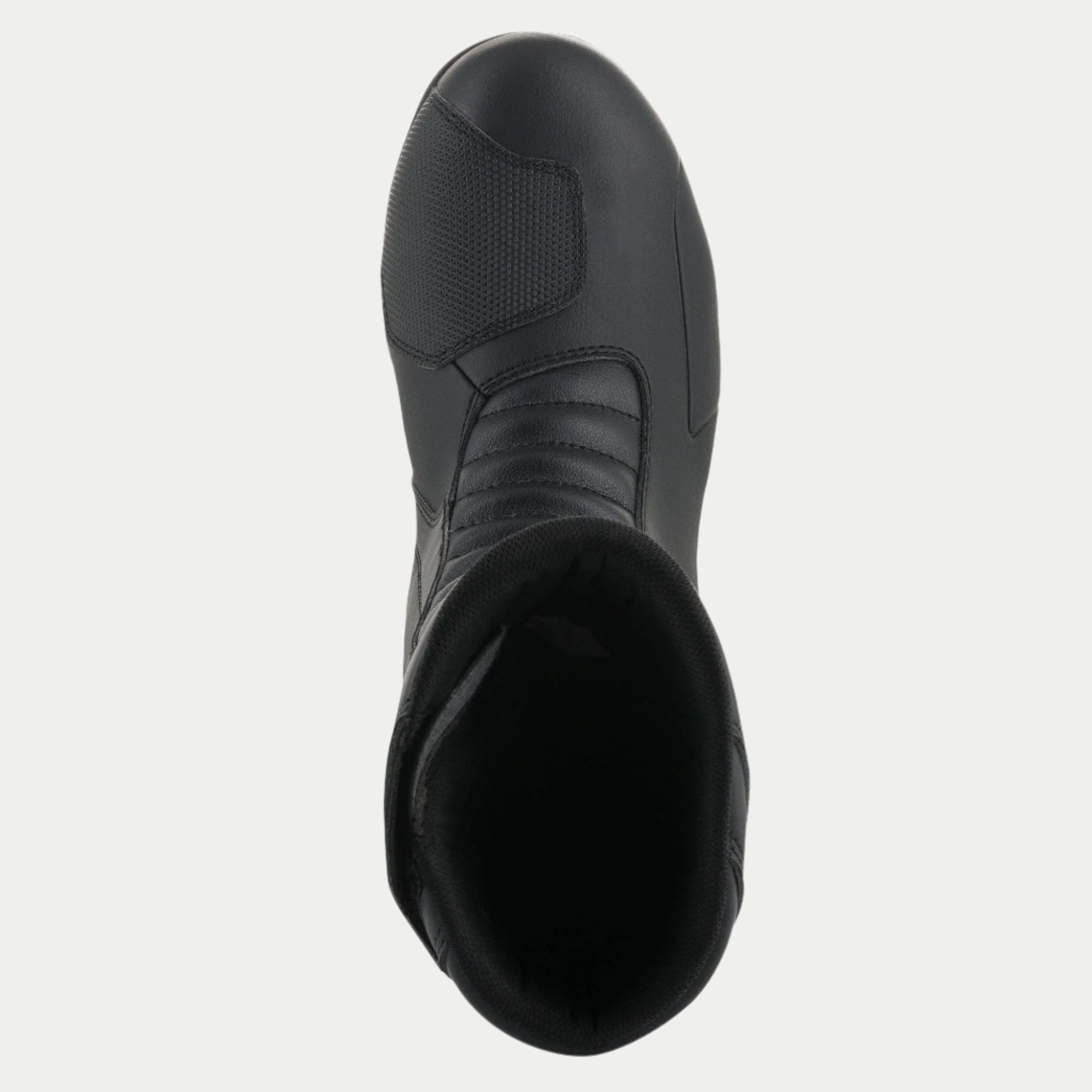 Bottes Alpinestars Origin Drystar®, noir, vue de dessus montrant la protection de sélecteur synthétique et la zone d'accordéon à l'avant, construction durable en microfibre, chaussures de moto imperméables pour le touring et l'aventure
