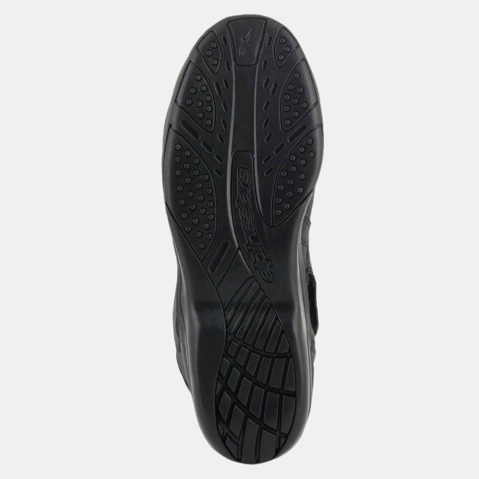 Bottes Alpinestars Origin Drystar®, noir, vue détaillée de la semelle extérieure en caoutchouc, motif d'adhérence texturé avec logo embossé, semelle durable pour le touring moto