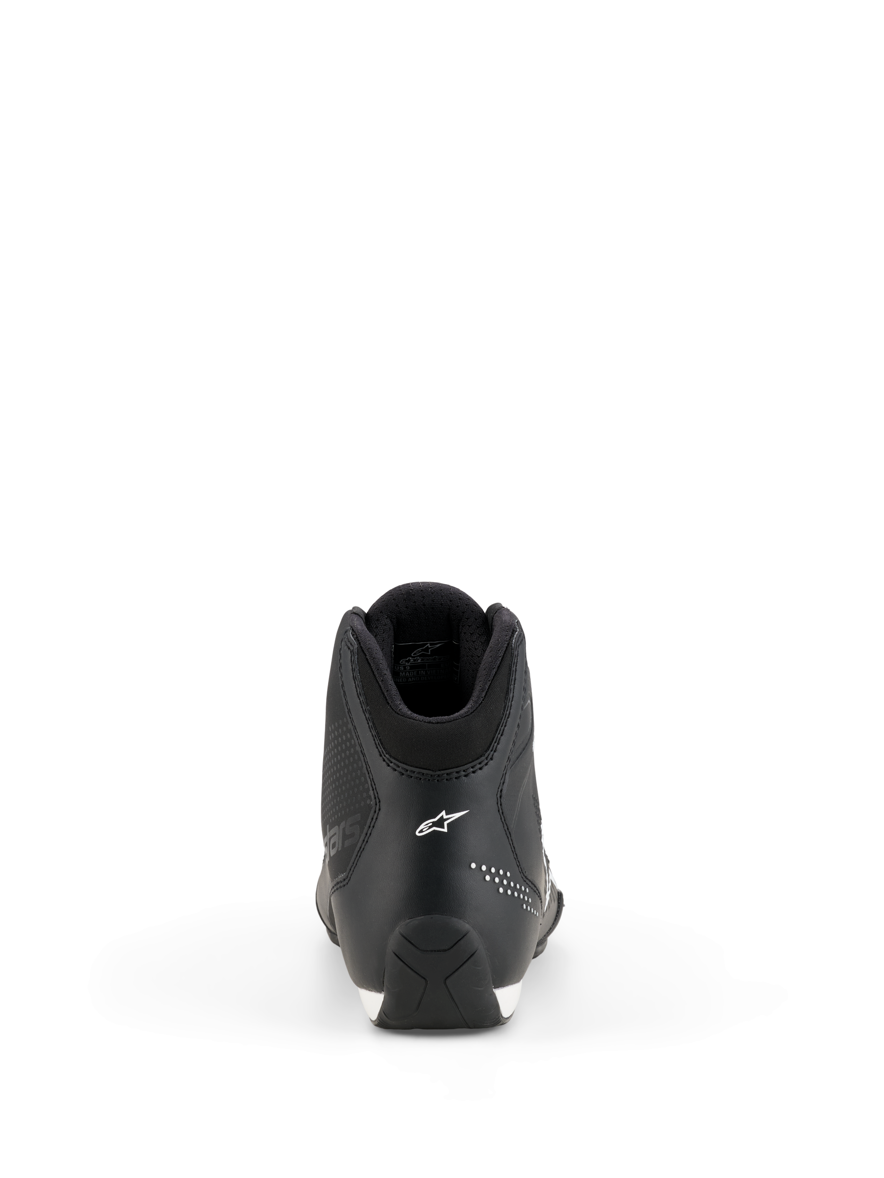 Chaussures Alpinestars Celer, chaussures de moto, noir et blanc, vue arrière montrant la construction du talon, logo étoile Alpinestars blanc, détails micro-perforés et semelle en caoutchouc texturé pour une conduite sportive haute performance