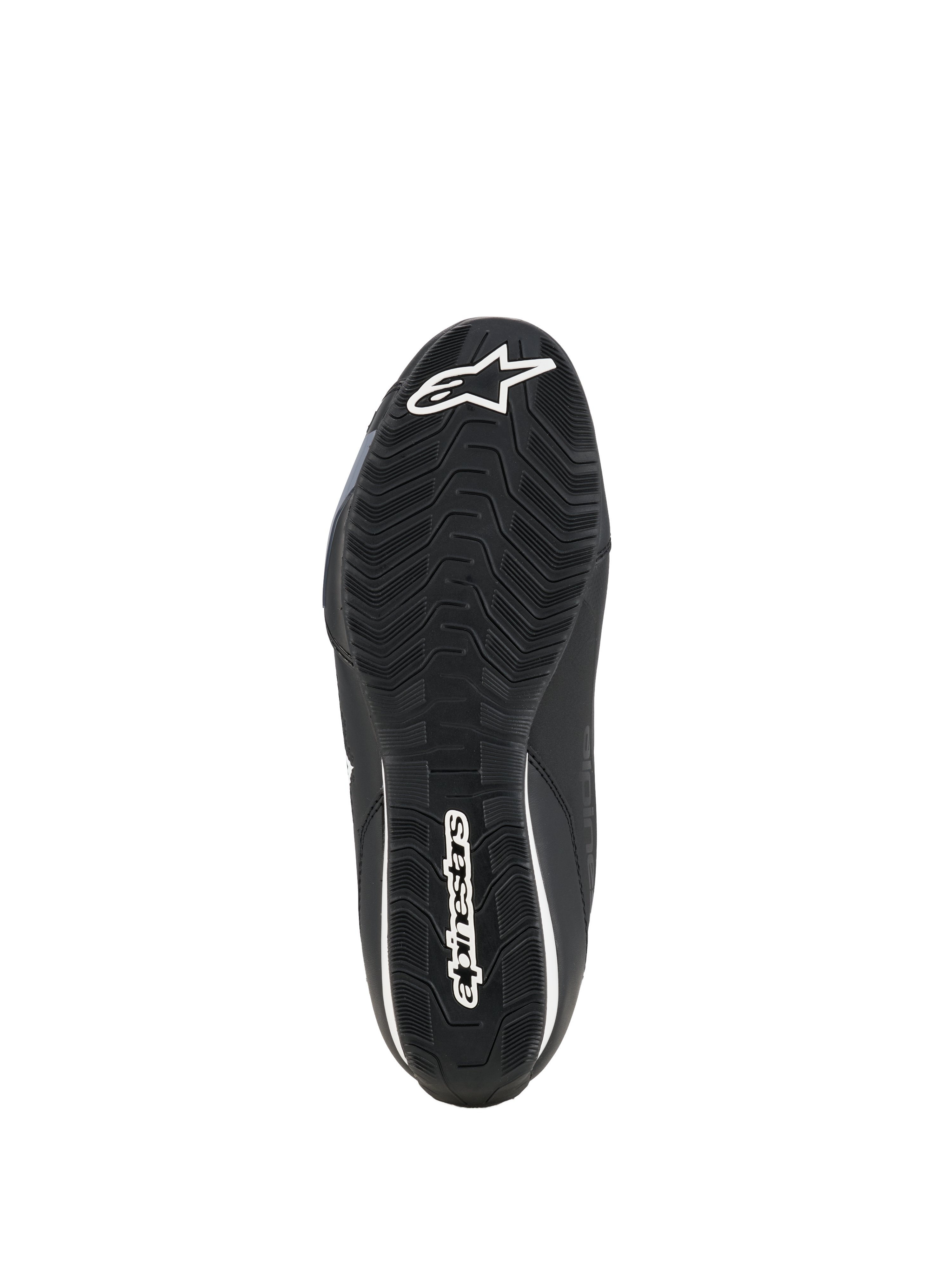 Chaussures Alpinestars Celer, chaussures de pilotage moto, noir et blanc, vue de dessous de la semelle en caoutchouc résistante à l'huile avec motif d'adhérence texturé et logo Alpinestars blanc.