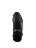 Chaussures Alpinestars Faster-4, chaussures de moto, noir et blanc, vue de dessus montrant la fermeture à lacets, la sangle de cheville auto-agrippante et le logo Alpinestars blanc sur le côté