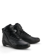 Chaussures Alpinestars Stella Faster-4 Drystar®, chaussures de moto imperméables pour femme, noir et argent, tige en microfibre avec fermeture à lacets et sangle de cheville, renforts protecteurs en TPU et logo Alpinestars.