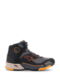 Chaussures de moto Alpinestars CR-X Drystar®, chaussures de moto urbaines, noires, grises et orange avec semelle intermédiaire marron clair, design montant avec sangle Velcro à la cheville, logo orange vif et semelle robuste avec accents orange