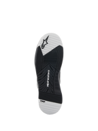 Alpinestars Speedflight-schoenen, zwart en wit, onderaanzicht van de buitenzool met dual-density rubberen zool, voorzien van Alpinestars-logo en TPF-branding, asymmetrisch profiel voor grip en stabiliteit tijdens het motorrijden
