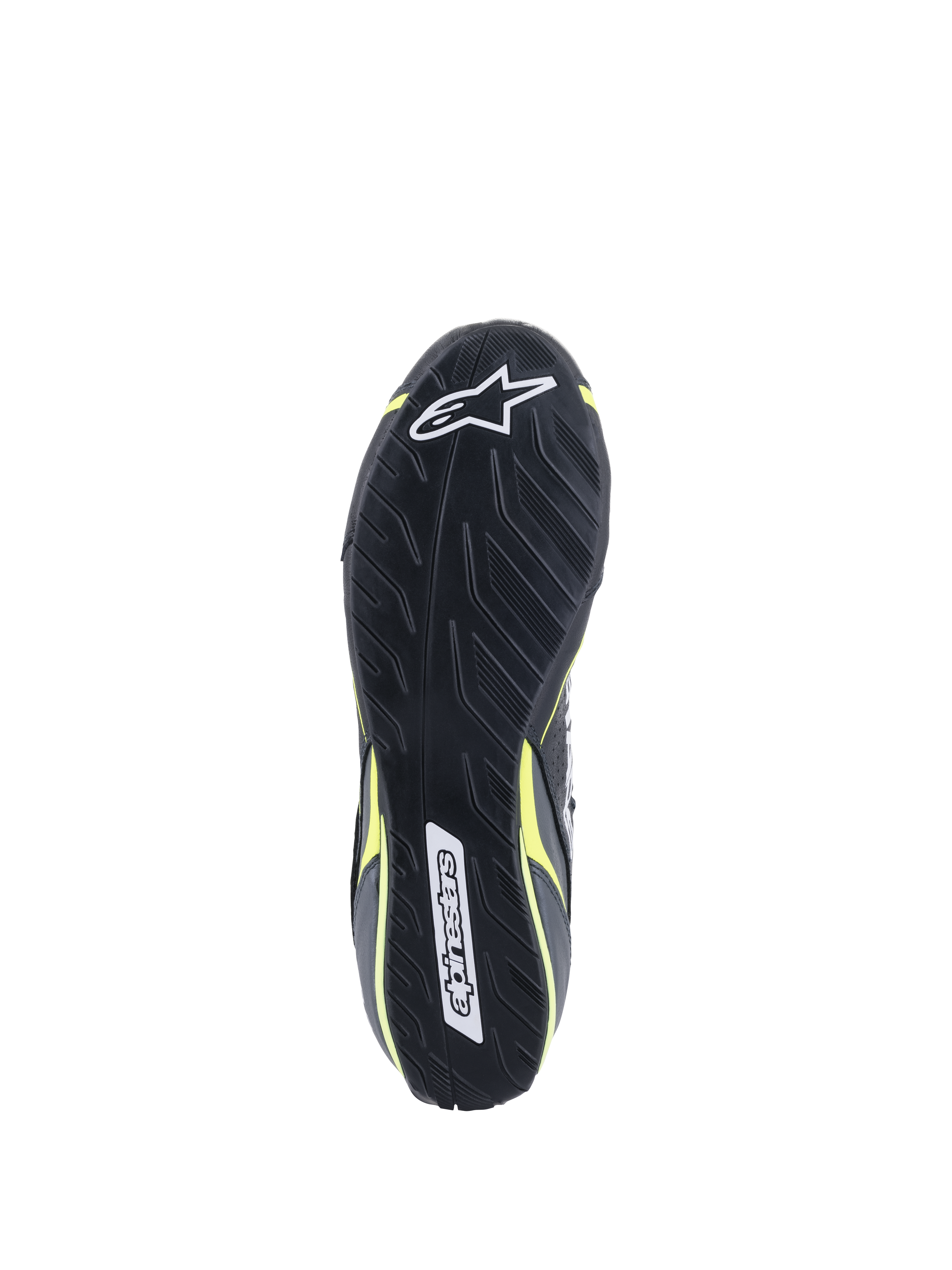 Alpinestars Tech-1 T V3 Shoes FIA, vue de la semelle extérieure, noir avec accents Jaune Fluo, semelle en caoutchouc asymétrique inspirée par la bande de roulement de pneus, avec logos Alpinestars et motif texturé pour la sensibilité aux pédales et l'adhérence.