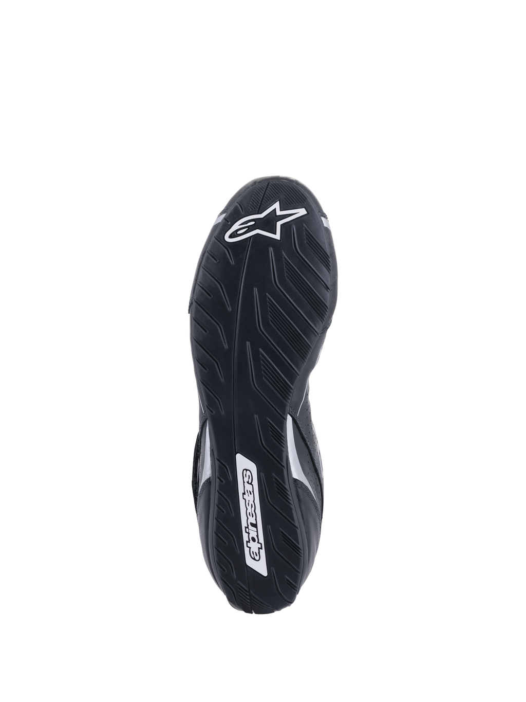 Alpinestars Tech-1 T V3 Shoes FIA, vue de la semelle extérieure, noir et argent, semelle asymétrique en caoutchouc avec motif de bande de roulement de pneu, logo Alpinestars blanc, composé mince pour une sensibilité optimale aux pédales