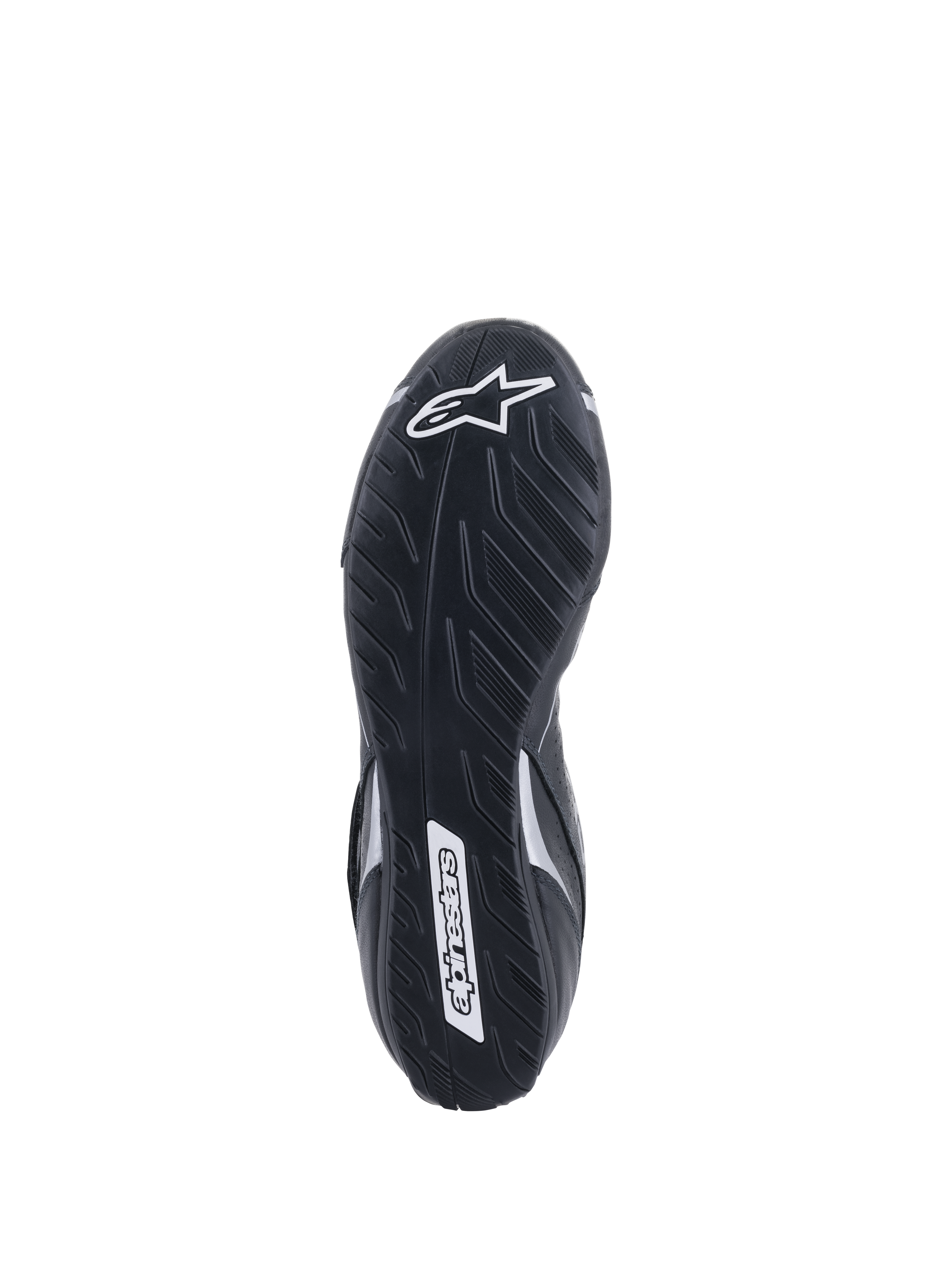 Alpinestars Tech-1 T V3 Shoes FIA, vue de la semelle extérieure, noir et argent, semelle asymétrique en caoutchouc avec motif de bande de roulement de pneu, logo Alpinestars blanc, composé mince pour une sensibilité optimale aux pédales