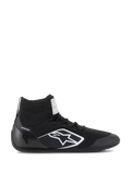 Chaussures Alpinestars Supertech, chaussures de course automobile certifiées FIA/SFI, noires avec logo étoile Alpinestars blanc, design montant avec tige tricotée et coque de talon en fibre de carbone, chaussures de sport automobile professionnelles