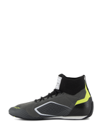 Chaussures Alpinestars Supertech - FIA/SFI, chaussures de course automobile, gris et noir avec accents jaune fluo, vue de profil, dotées d'une tige tricotée en aramide et d'une coque de talon en fibre de carbone, équipement de sport automobile professionnel