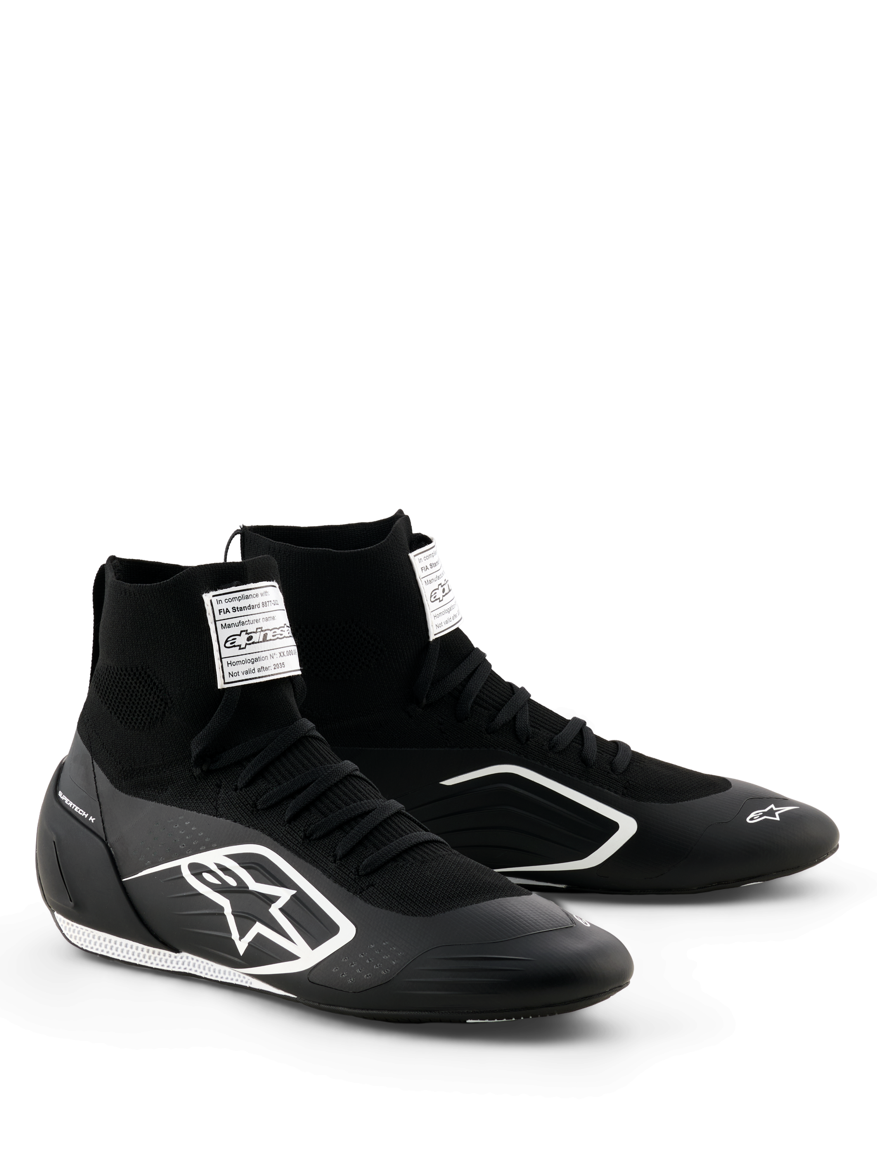 Alpinestars Supertech K Shoes - FIA, Karting Shoes, Black and White, fully knitted upper with high-top sock-like fit, white Alpinestars logo on the side, white FIA certification label on the tongue, sleek lightweight design for racing performance