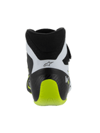 Alpinestars Tech-1 KX V3 schoenen, FIA-gecertificeerde kartingschoenen, zwart, wit en fluogeel, achteraanzicht met de versterkte eendelige hiel, fel fluogeel accent, witte panelen met zwart logo, technische motorsportschoenen voor gebruik op het circuit