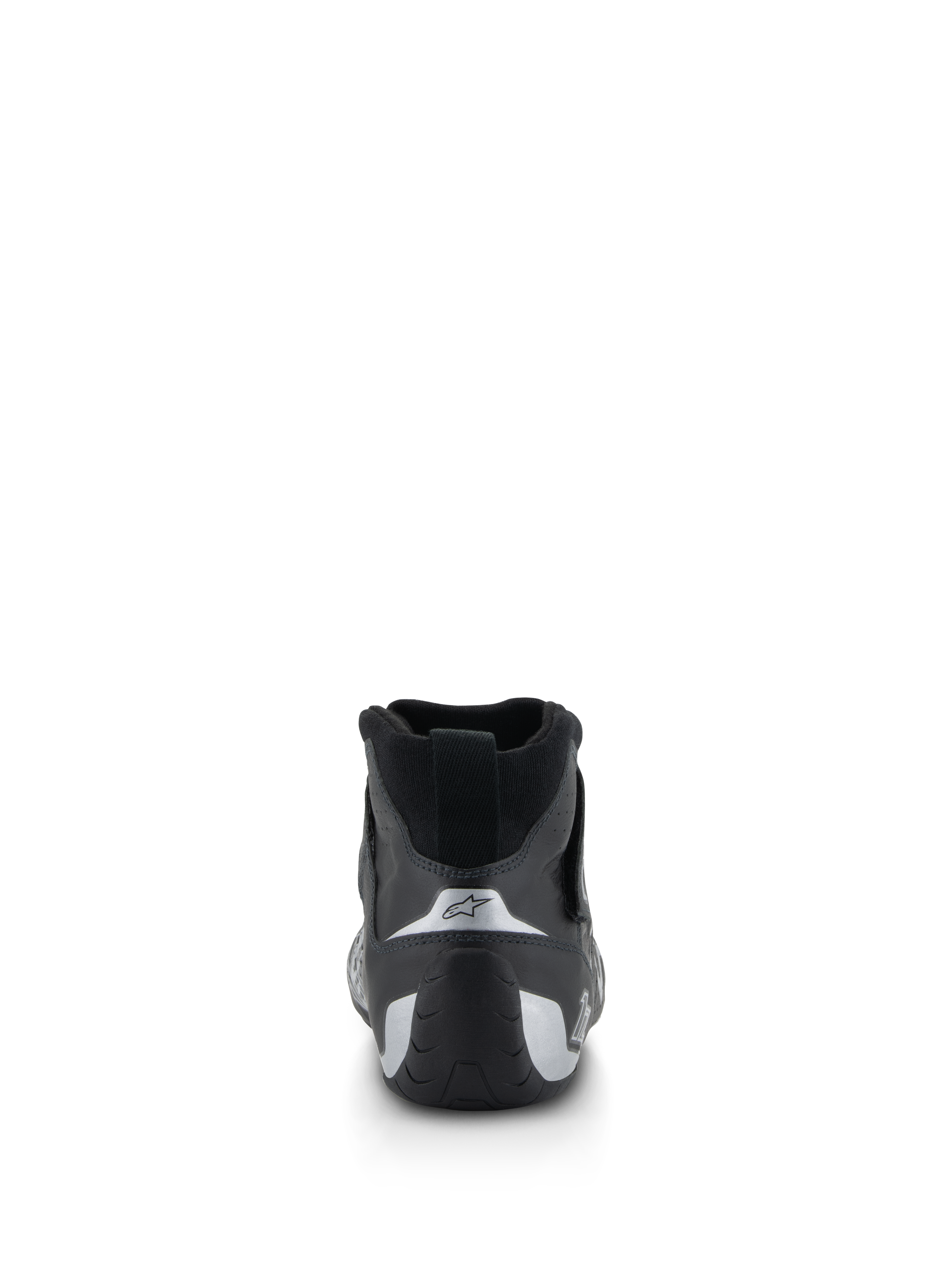 Alpinestars Tech-1 Z V3 Shoes FIA, chaussures de course automobile, noir et argent, vue arrière montrant le talon profilé avec des accents argentés et le logo en étoile, équipement professionnel de sport automobile