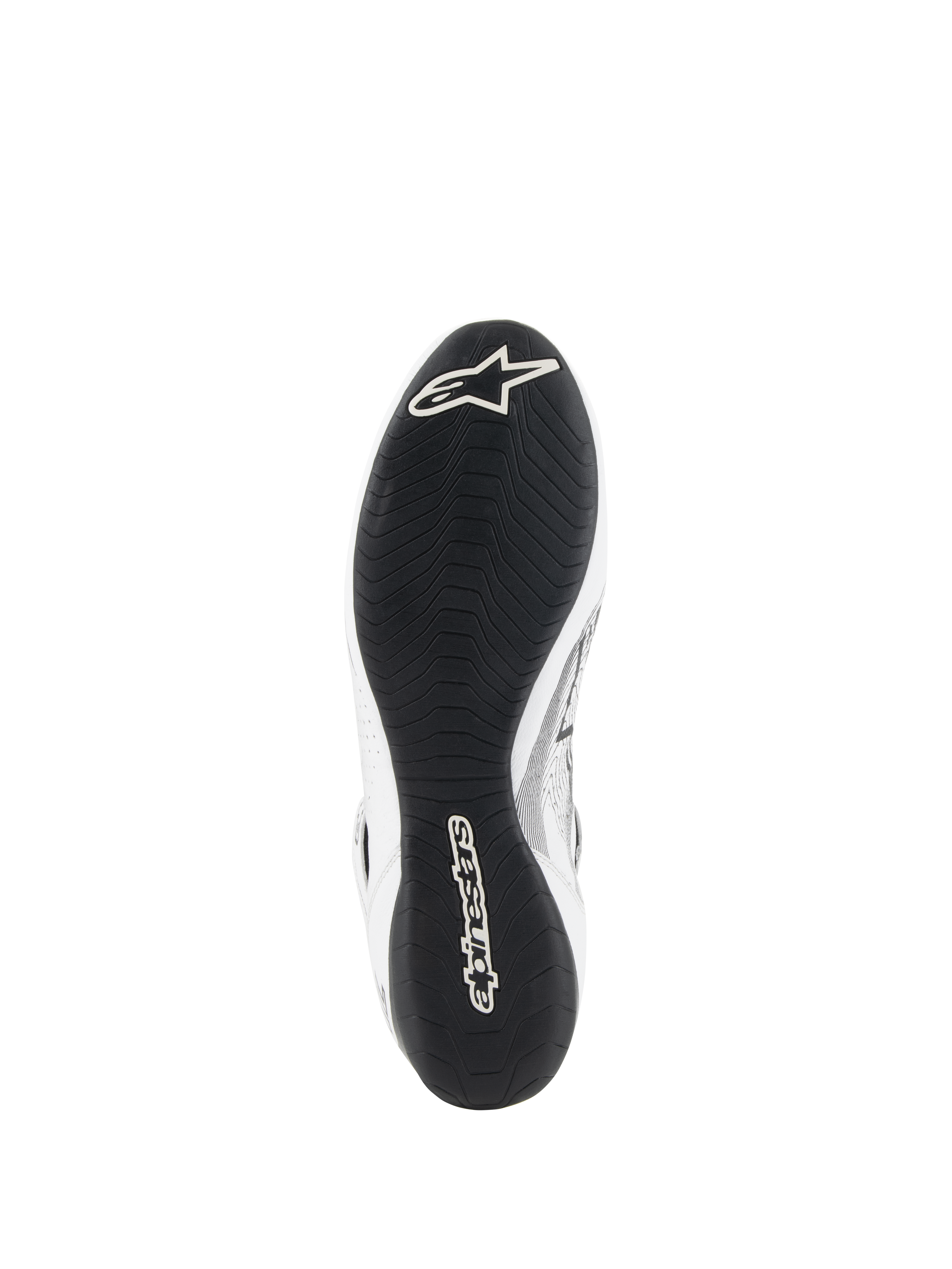 Chaussures Alpinestars Tech-1 Z V3 FIA, chaussures de course automobile, blanc et noir, vue de dessous montrant la semelle extérieure en caoutchouc fin inspirée de la F1 avec bande de roulement asymétrique, logo Alpinestars blanc sur la pointe et marquage sur le talon