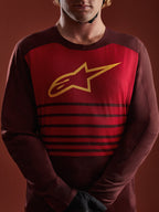 A-Dura Elite jersey met lange mouwen in bordeaux, rood borstpaneel met geel A-star logo en horizontale strepen.