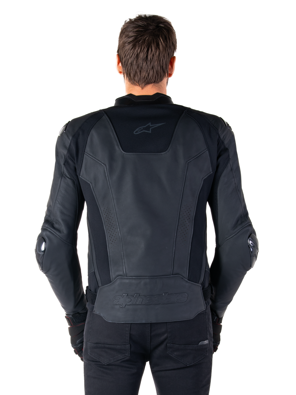Vue arrière d'un pilote portant la veste en cuir Alpinestars Missile V3 noire, dotée d'une construction en cuir premium avec des panneaux extensibles techniques, logo Alpinestars embossé dans le bas du dos et marquage discret en haut du dos, associée à un pantalon noir pour un look sportif de course coordonné.