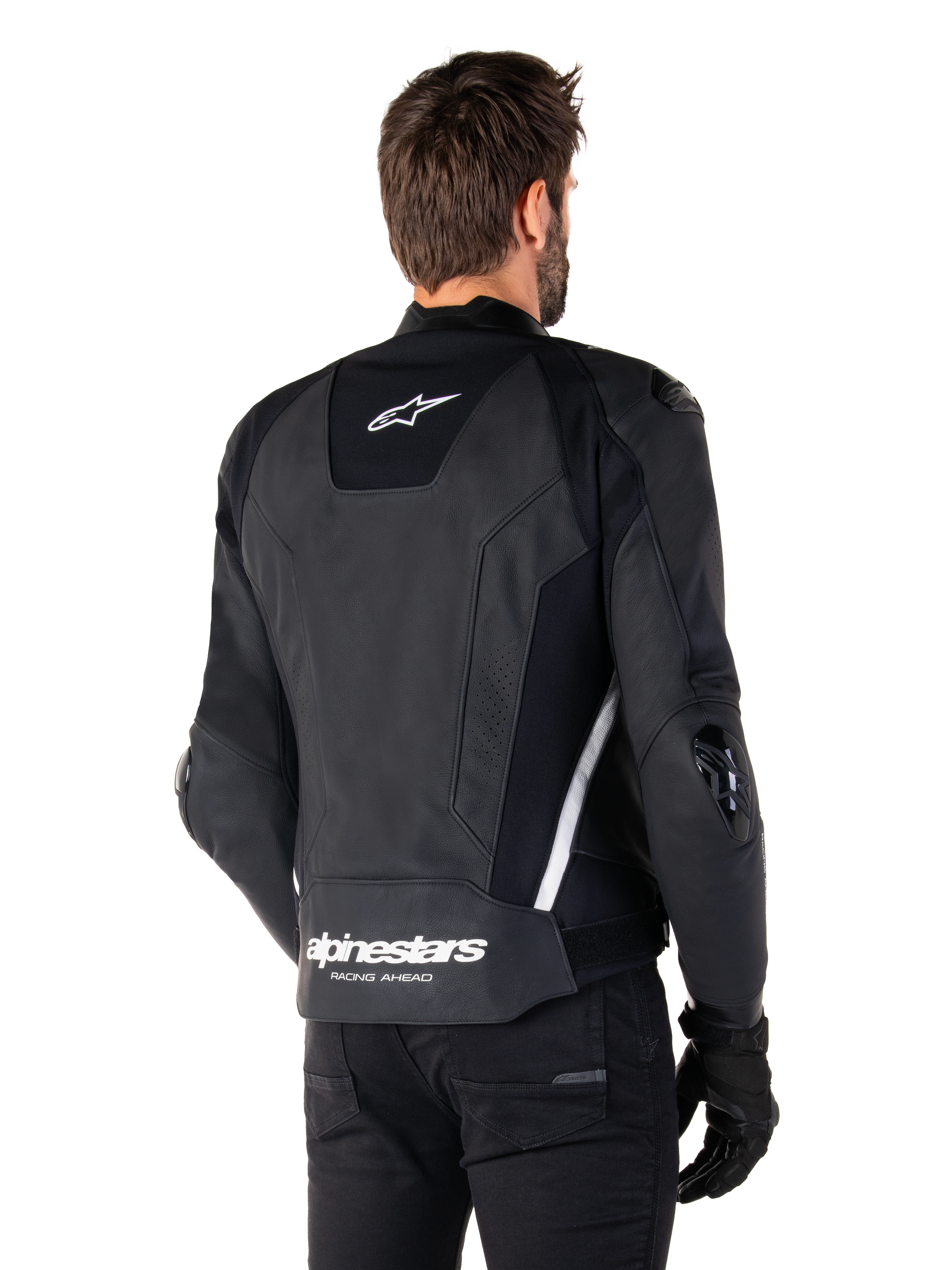 Veste en cuir Alpinestars Missile V3, vue de dos, noir et blanc, avec le logo étoile Alpinestars sur le haut du dos et le nom de la marque sur le bas du dos, sliders de protection aux coudes et aux épaules, équipement de course en cuir premium