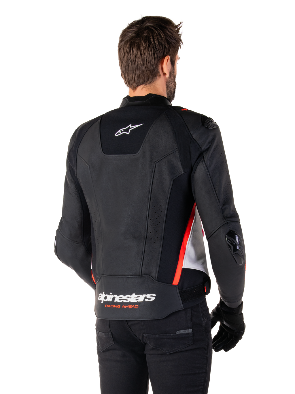 Alpinestars Missile V3 Leren Jas, achteraanzicht op een motorrijder, zwart wit en fluorood, met opvallende Alpinestars-branding en 'RACING AHEAD' tekst op de onderrug, hoogwaardige lederen constructie met technische stretchpanelen en beschermende TPU-sliders, gedragen met zwarte handschoenen en broek.
