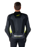 Alpinestars Missile V3 Airflow Lederjacke, Rückansicht, Schwarz mit gelb-fluo und weißen Akzenten, großflächige perforierte Lederbahnen zur Kühlung, Alpinestars-Logo auf dem oberen und unteren Rücken, rennsportinspirierte Motorrad-Sportjacke