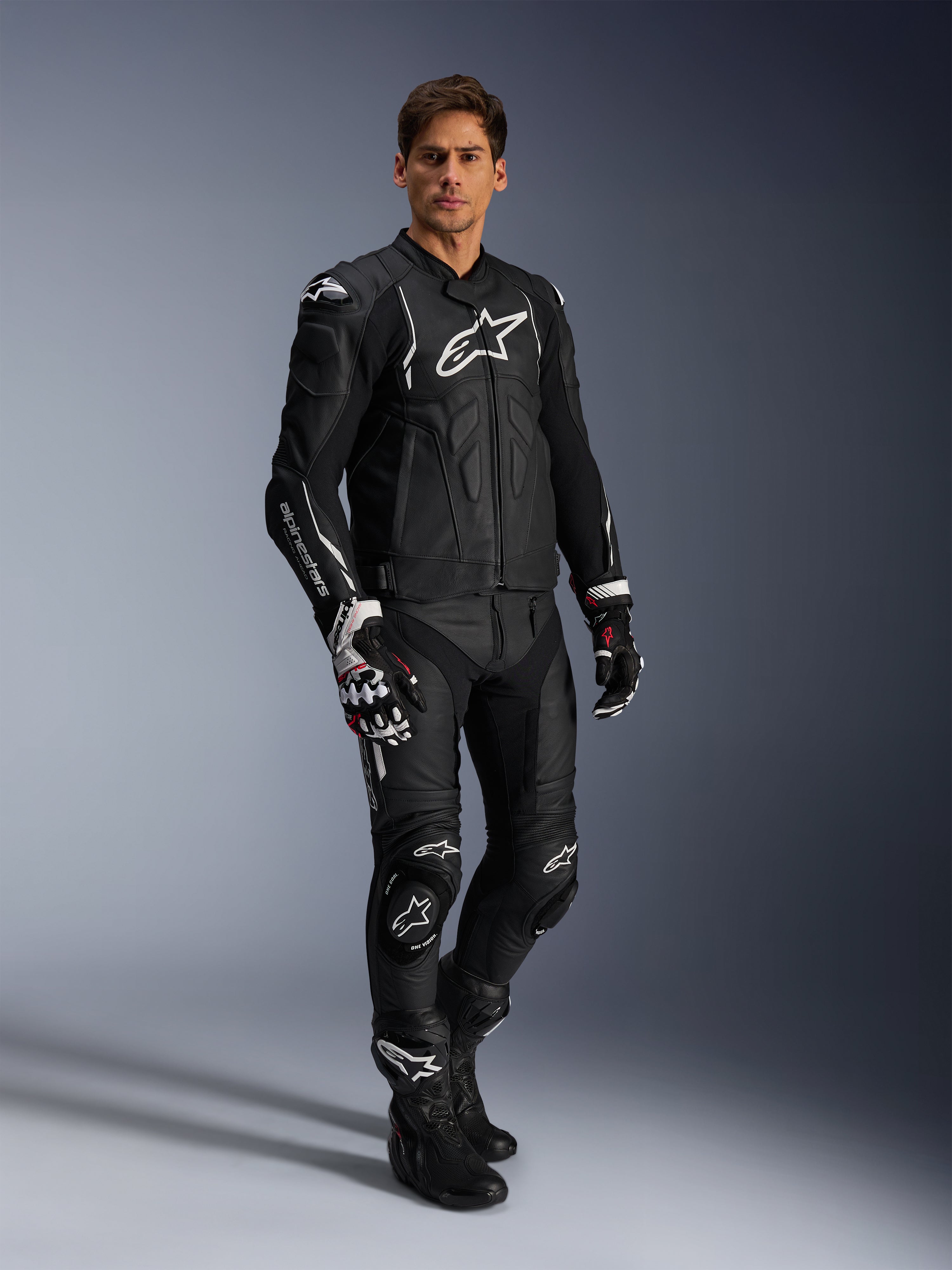 Alpinestars Missile V3 Leather Pants and matching black leather jacket, full motorcycle racing suit, black with white Alpinestars branding on chest and knees, includes professional racing gloves and boots, sleek protective gear for road and track.