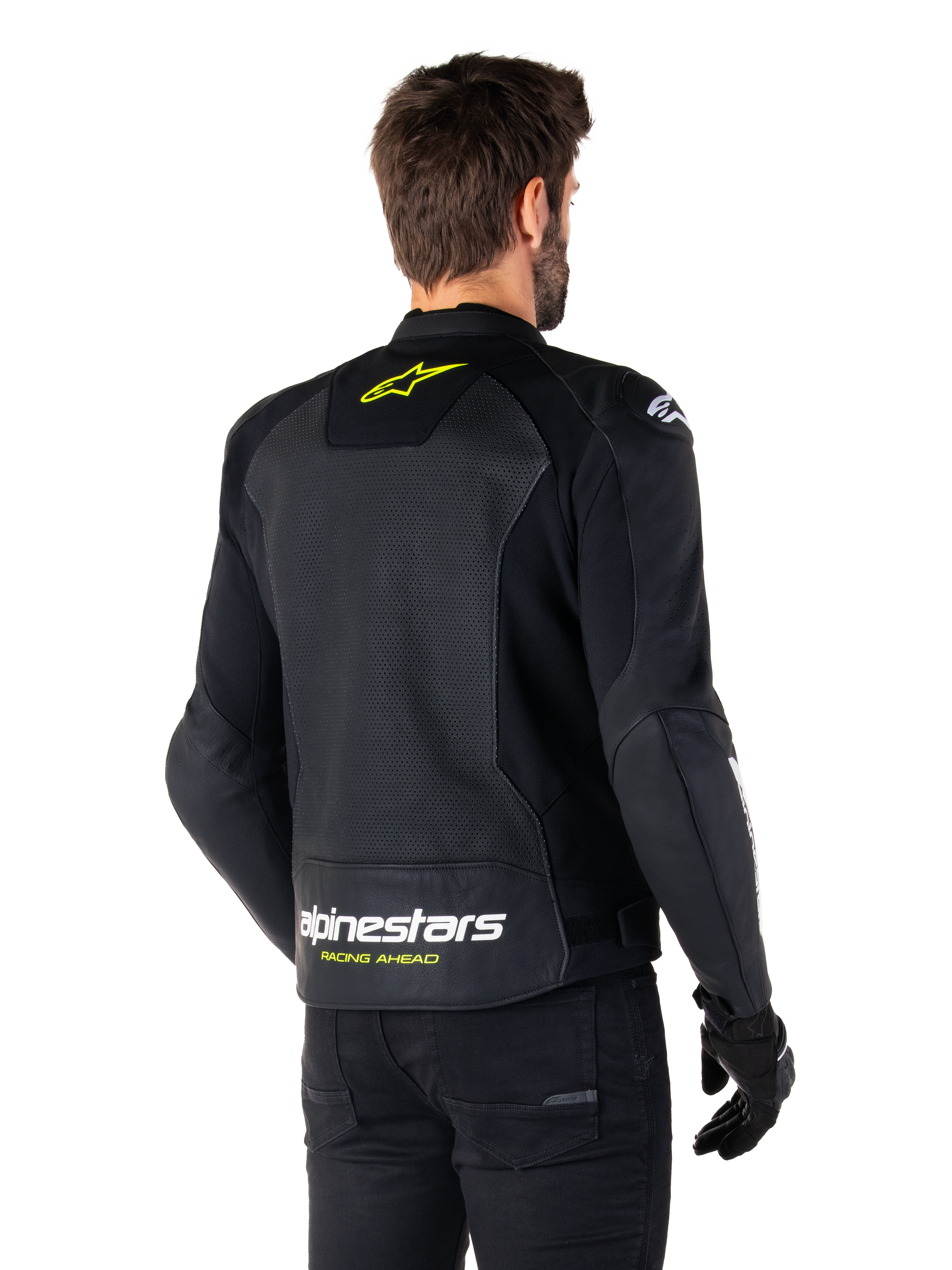 Veste en cuir Alpinestars Faster V3 Airflow, noir, blanc et jaune fluo, vue arrière, dotée d'un grand panneau dorsal en cuir perforé pour la ventilation, logo étoile jaune sur le col et marquage Alpinestars blanc avec texte « Racing Ahead » jaune sur l'ourlet inférieur, équipement de moto sportive