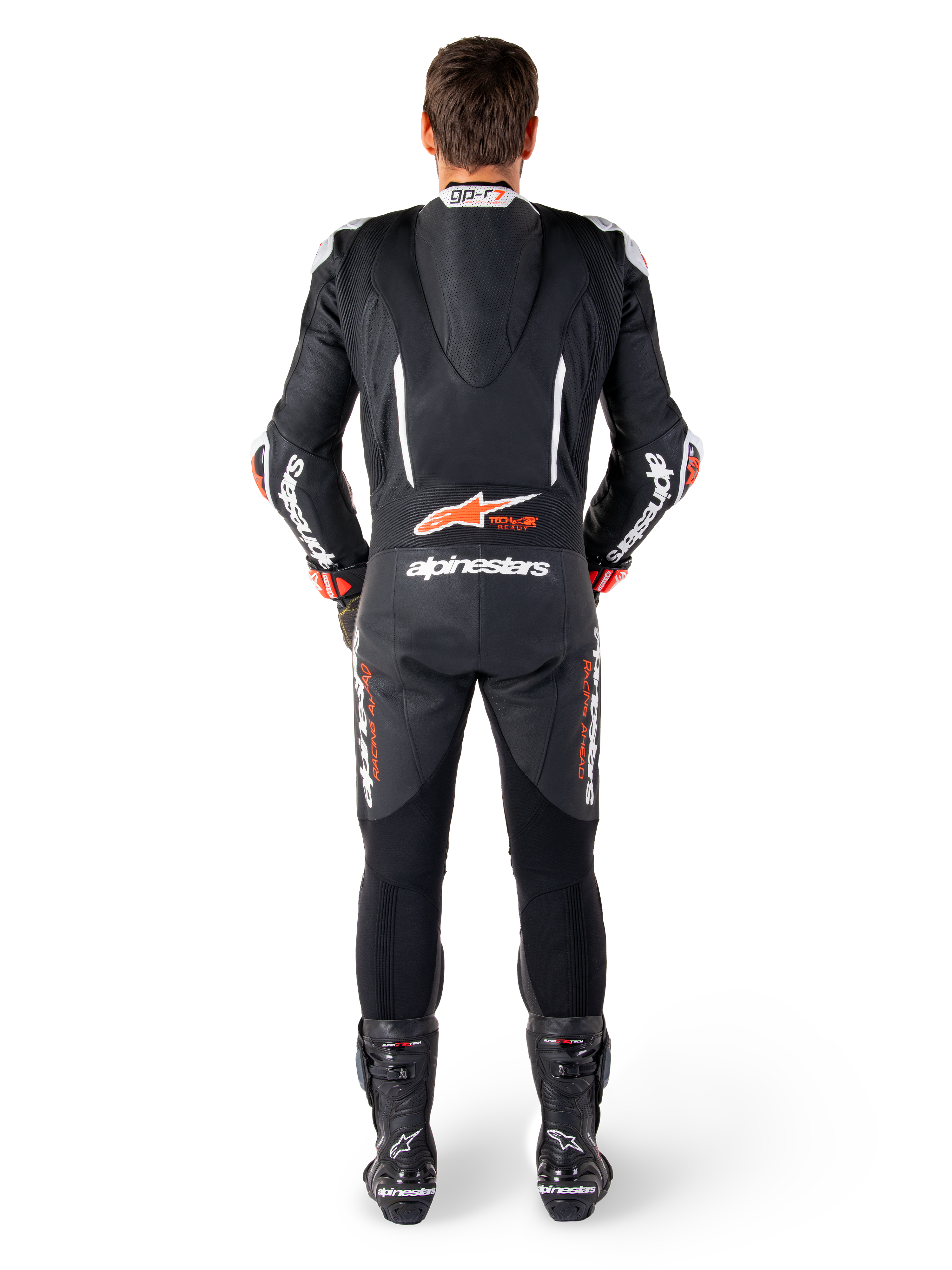 Alpinestars GP-R7, combinaison cuir noire et blanche, rouge fluo, bosse aérodynamique et panneaux en accordéon, vue de dos