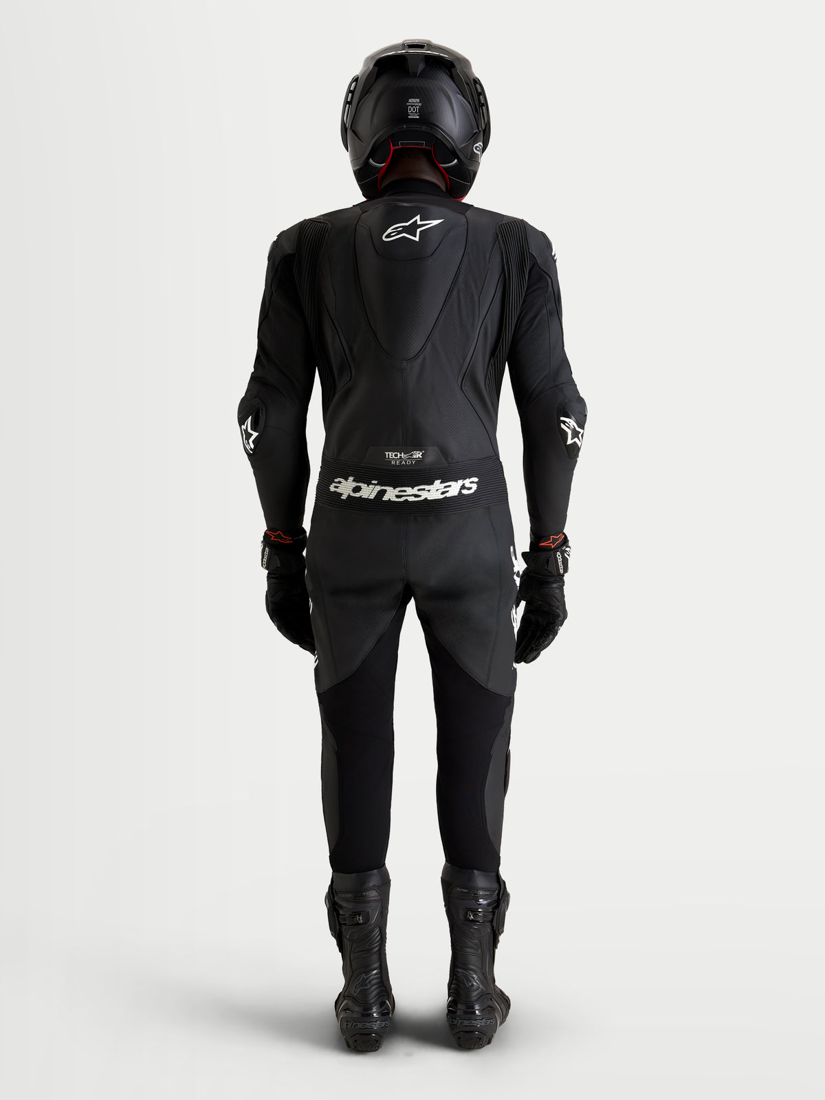 Alpinestars Missile V3 Leather Suit - 1 Piece, combinaison en cuir noire pour moto, vue de dos montrant la bosse aérodynamique et la construction de course