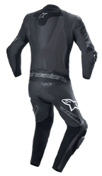 Combinaison en cuir Alpinestars Missile V2 Ward 1 pièce, noir gris métallisé, vue arrière présentant la bosse aérodynamique, des panneaux d'aisance en accordéon au bas du dos et aux épaules, le marquage Alpinestars sur les cuisses et le logo Tech-Air Ready.