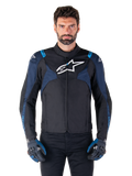 Alpinestars T-Jaws V4 Waterproof Jacket, Motorcycle Jacket, Black and Dark Blue with Blithe Blue accents, white logo on chest, blue text on shoulders, worn with matching gloves, waterproof textile riding gear