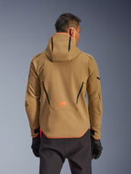 Alpinestars Aeroshell Waterproof Jacket, Dark Khaki and Orange Fluo, rear view showing hoodie design with orange trim on the hood and hem, orange logo on lower back, worn with black gloves, crossover sports softshell motorcycle gear.