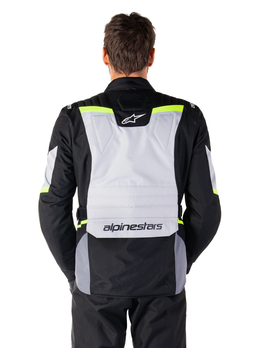 Alpinestars ST-1 Waterproof Jacket, Adventure Touring Jacket, Ice Gray Black and Yellow Fluo, back view on a model, featuring a light gray rear panel with Alpinestars logos, neon yellow accents, and streamlined protective design