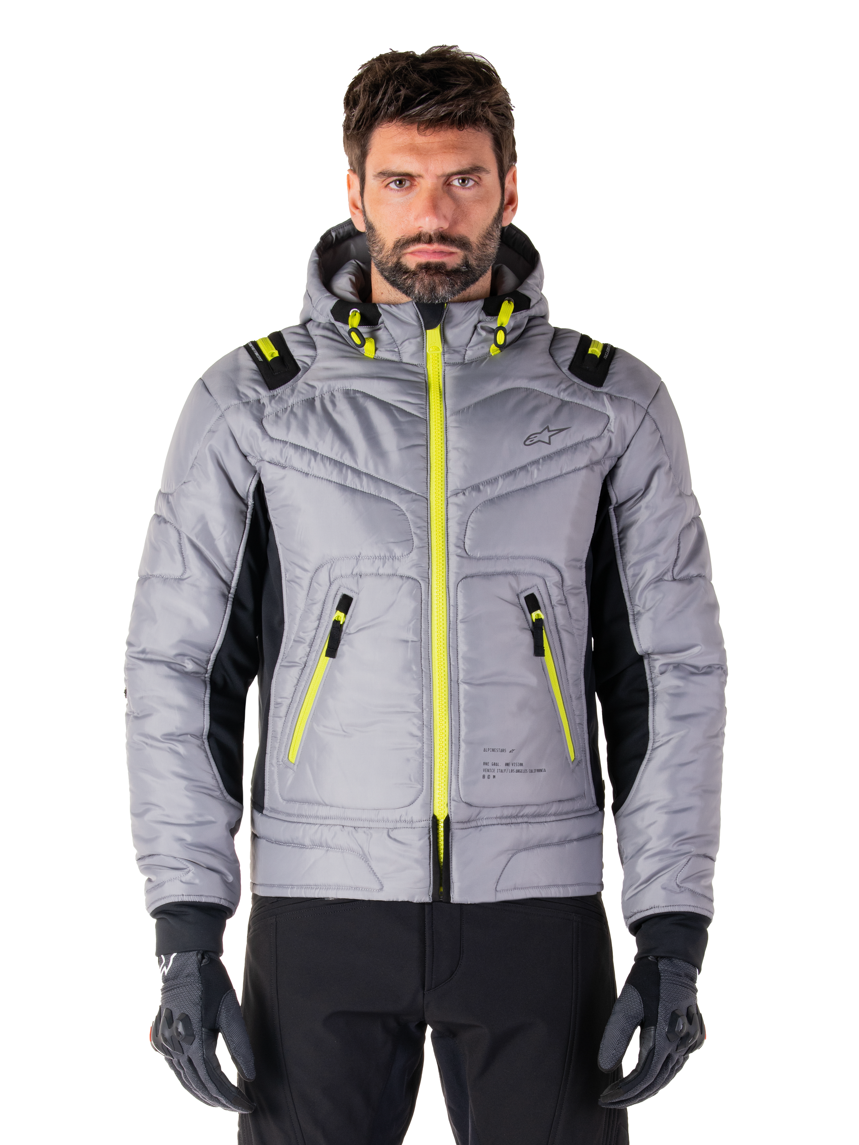 Alpinestars Mohobbs Waterproof Jacket, urban motorjas, Lunar Gray met Lime Punch accenten, gewatteerd bomberdesign met capuchon, felgele ritsen en zwarte zijpanelen, op streetwear geïnspireerde beschermende motorkleding