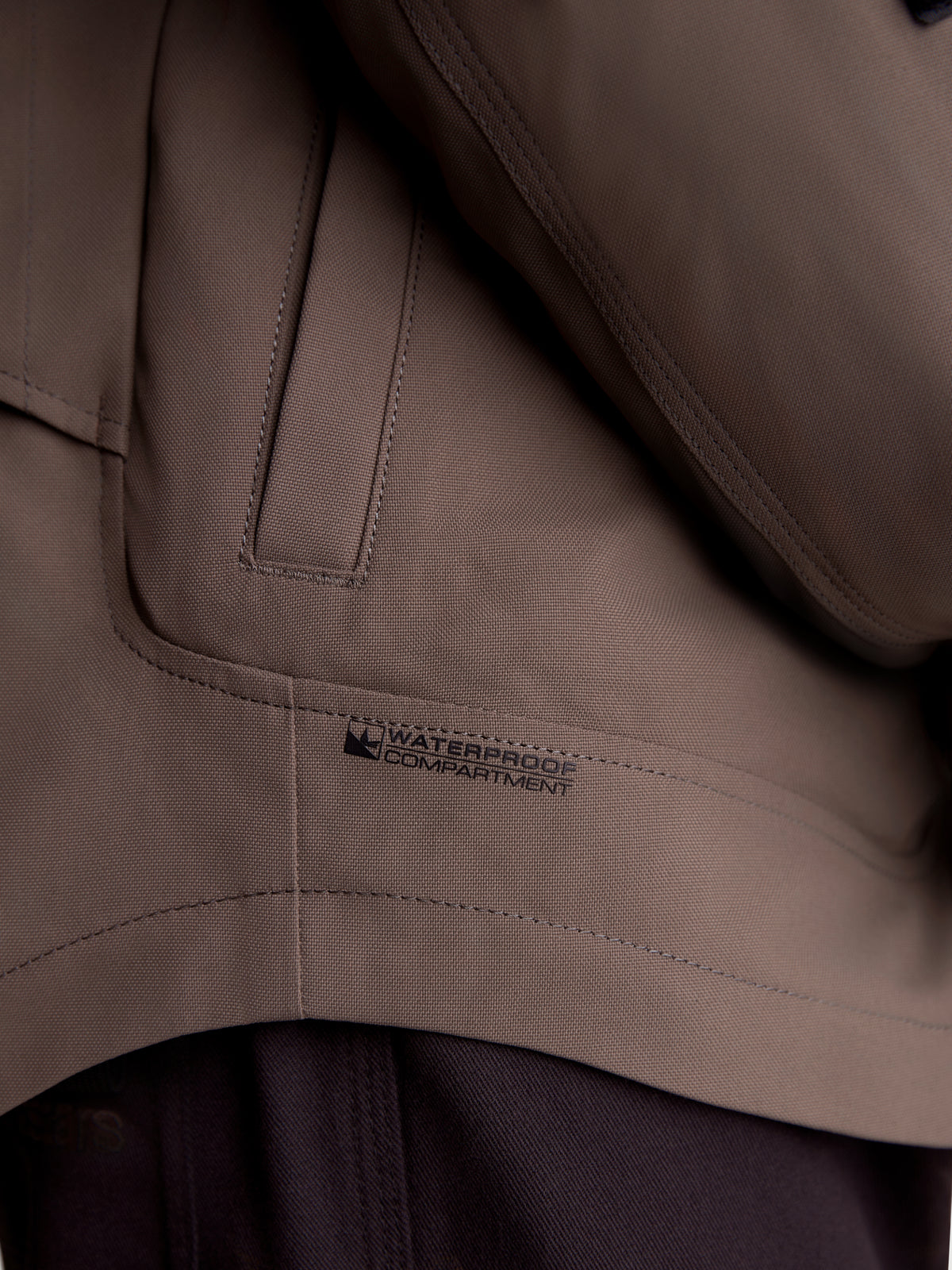 Alpinestars Altan Drystar Jacket, close-up detail of the walnut brown waterproof compartment and pocket construction on the matte polyfabric textile motorcycle jacket