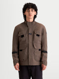 Alpinestars Altan Drystar Jacket, men's urban contemporary waterproof motorcycle jacket in walnut brown, front view worn by a model showing field-jacket storage pockets and warm collar construction