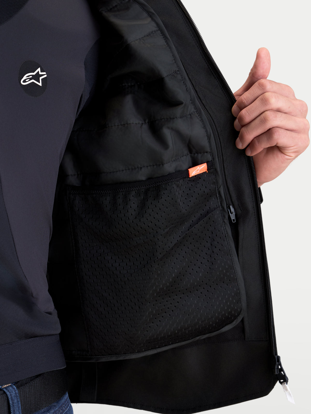 Alpinestars Zaca V2 Waterproof Jacket, closeup of interior mesh pocket and thermal liner construction, Black, AA certified motorcycle road gear