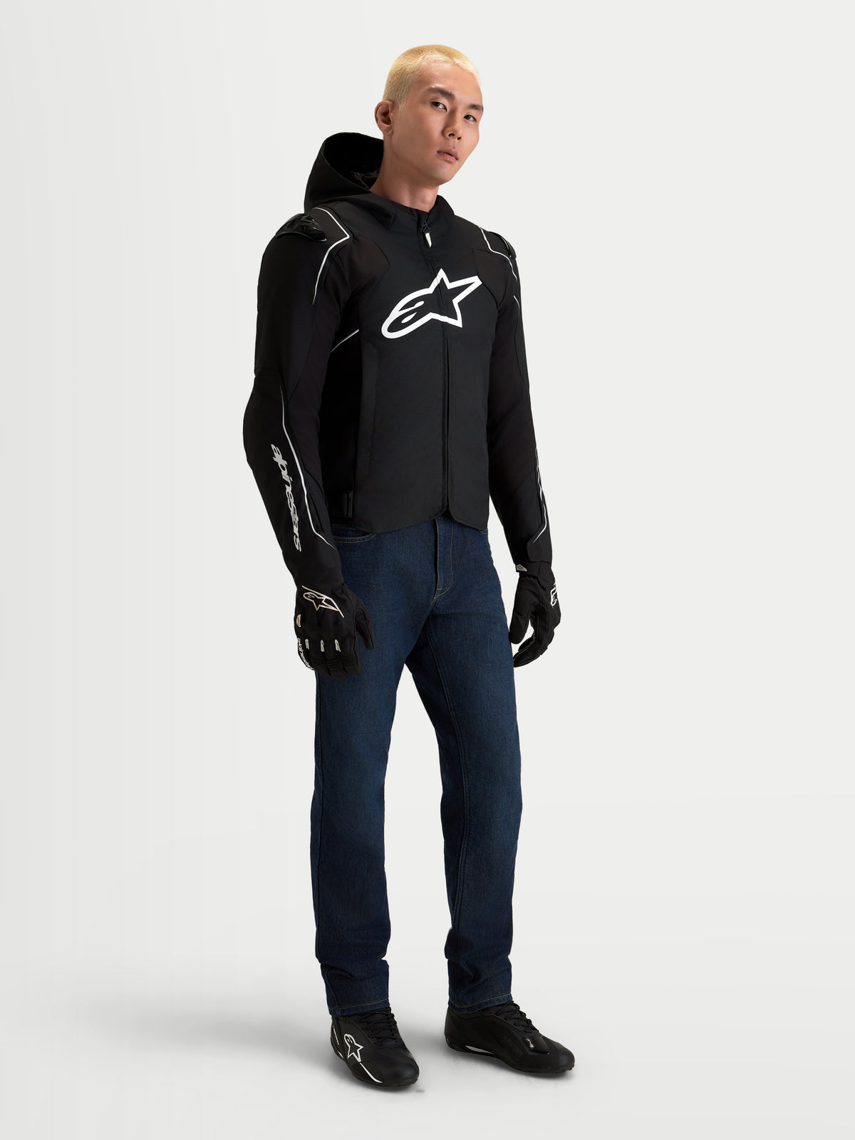 Alpinestars Zaca V2 Waterproof Jacket, Men's Black and White motorcycle racing jacket, worn by a model with DFS shoulder armor and waterproof textile construction