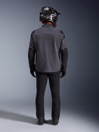 Alpinestars Maxdura Drystar®XF Laminated Armored Shell, Deep Gray Black, full-length back view, technical adventure jacket with reinforced panels, worn with black riding pants, gloves, and a black and white off-road helmet, coordinated dual-sport gear ensemble