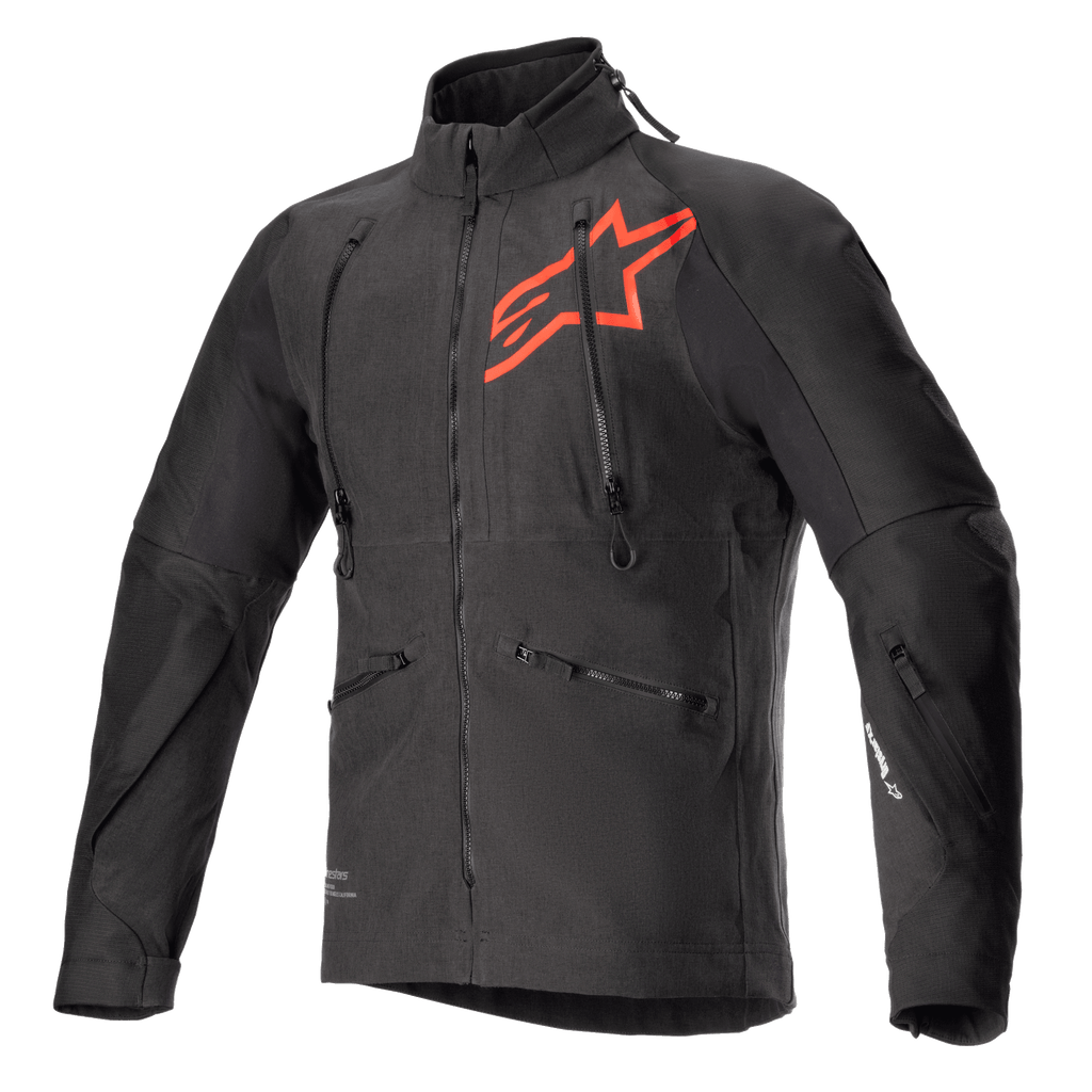 Alpinestars Hyde XT Drystar XF motorjas, zwarte en felrode technische motorjas, groot rood sterlogo op de borst, verticale ventilatieritsen op de borst, hoge kraag, getextureerde vierwegstretchstof, ontworpen voor adventure en off-road rijden
