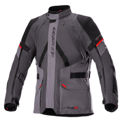 Alpinestars Monteira Drystar XF Jacket, Motorcycle Touring Jacket, Dark Gray and Tar Gray with Black panels and Bright Red accents, featuring front cargo pockets, adjustable waist and arm straps, vertical Alpinestars branding, and a high collar, designed for adventure riding