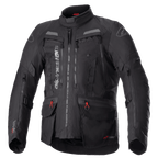 Veste Alpinestars Bogota Pro Drystar, veste de moto touring noire, accents gris et rouges, dotée de larges panneaux de ventilation sur la poitrine, poches imperméables avec tirettes rouges, col protecteur haut et construction textile durable pour le pilotage d'aventure