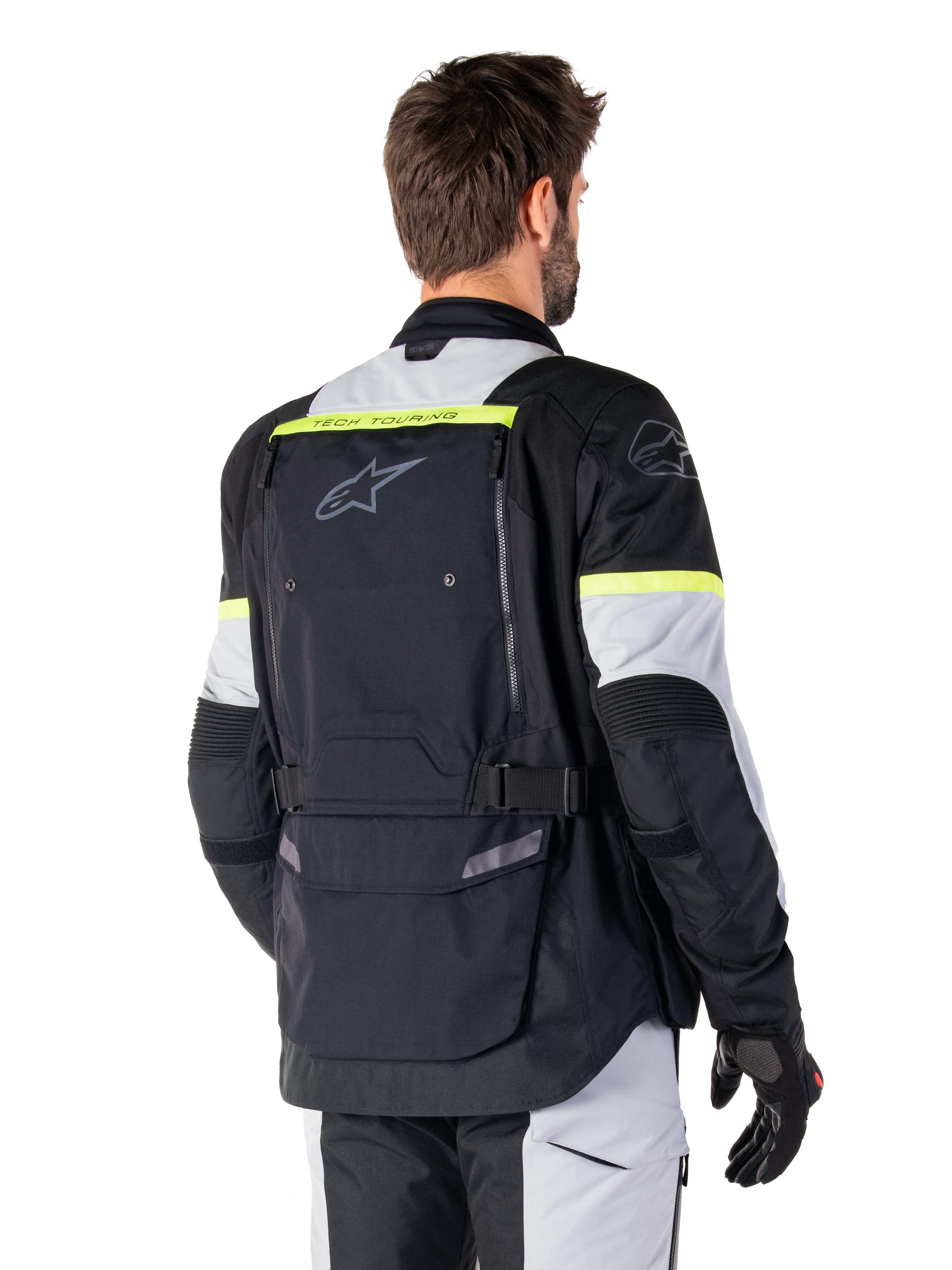 Alpinestars Bogota' Pro Drystar® Jacket, adventure touring jacket, Black Ice Gray and Yellow Fluo, rear view featuring large back pocket panel with 'TECH TOURING' branding, Alpinestars logo, and fluorescent accents, technical textile riding gear