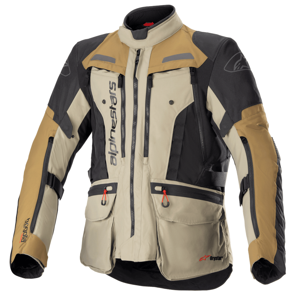Alpinestars Bogota Pro Drystar Jacket, veste de moto aventure touring, beige, noir et tan, construction textile imperméable, poches multiples avec tirettes rouges, zones de protection renforcées et col haut