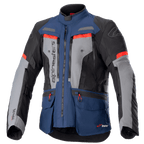 Alpinestars Bogota Pro Drystar Jacke, Motorrad-Adventure-Tourenjacke, Dunkelblau und Schwarz mit grauen Brustpaneelen und leuchtend roten Akzenten, wasserdichte Textilkonstruktion, mehrere Belüftungsreißverschlüsse und Funktionstaschen.