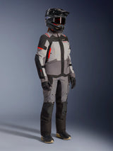 Alpinestars Stella Andes V4 Drystar® Women's Adventure Jacket, Gray and Black with Coral Fluo, worn by a touring rider.